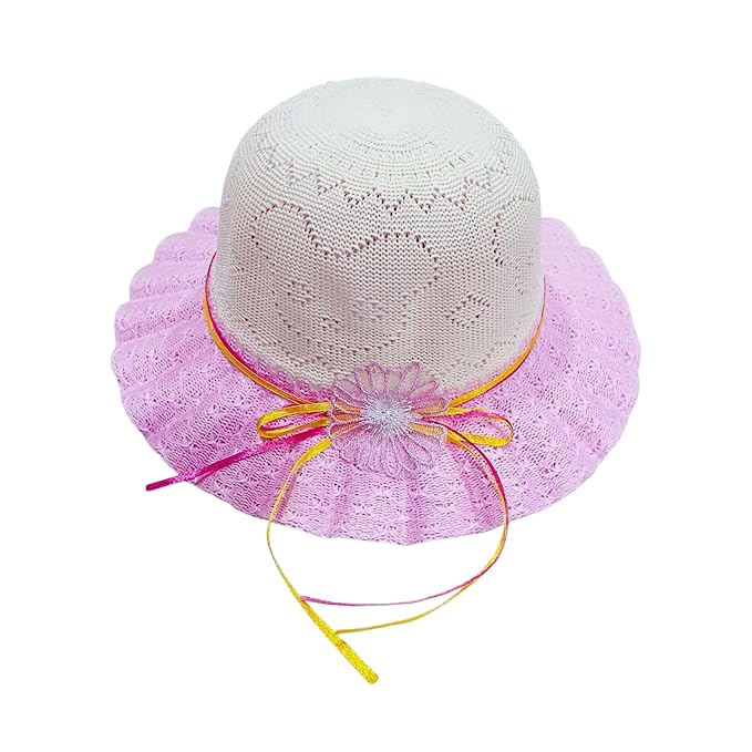 The image shows a white crocheted hat with a pink lace brim, tied with a pink and yellow ribbon featuring a decorative bow, set against a plain white background.